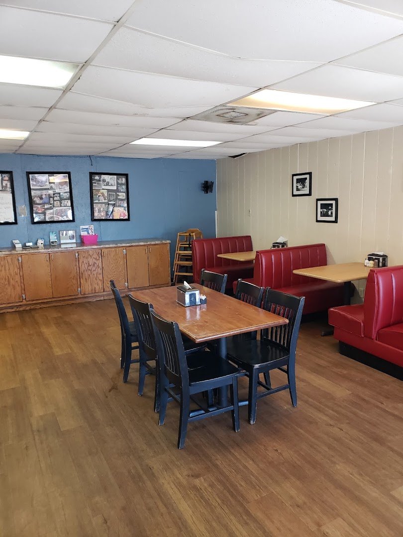 Casual dining room with simple tables and chairs.